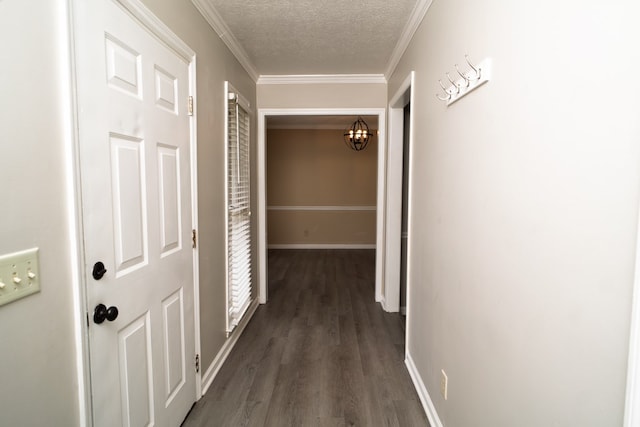 2 Labrador Ct, Columbus, GA 31909 - hallway with a textured ceiling, dark wood-style floors, a chandelier, and ornamental molding