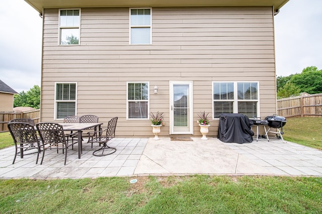37 Oakwood Dr, Phenix City, AL 36870 - back of property with a fenced backyard and a patio area
