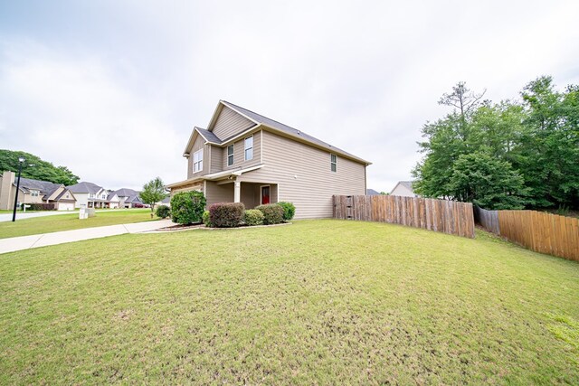 37 Oakwood Dr, Phenix City, AL 36870 - view of side of home with concrete driveway and an attached garage