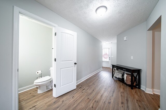 37 Oakwood Dr, Phenix City, AL 36870 - hall featuring a textured ceiling and wood finished floors