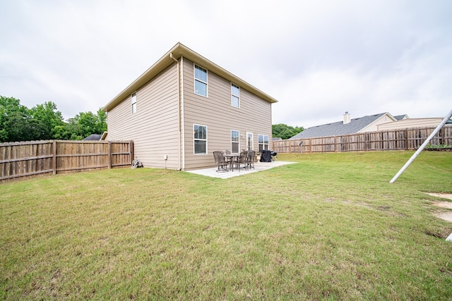 37 Oakwood Dr, Phenix City, AL 36870 - back of house with a fenced backyard and a patio