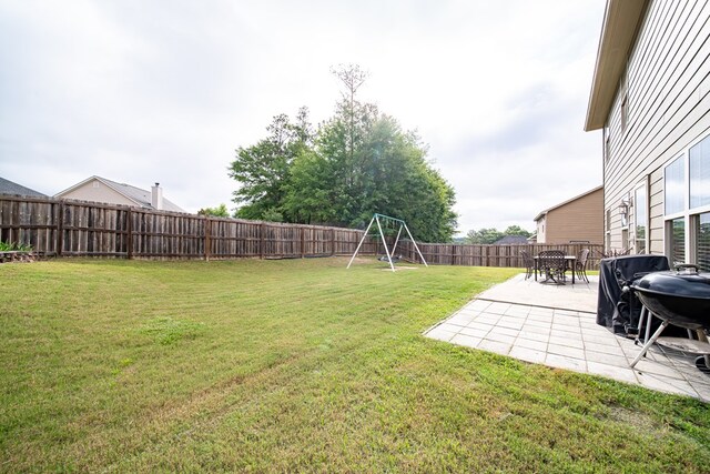 37 Oakwood Dr, Phenix City, AL 36870 - fenced backyard featuring a patio
