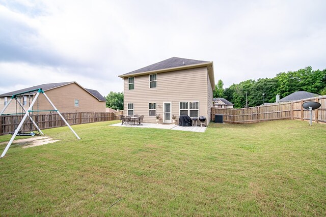 37 Oakwood Dr, Phenix City, AL 36870 - rear view of property with a playground, a fenced backyard, and a patio
