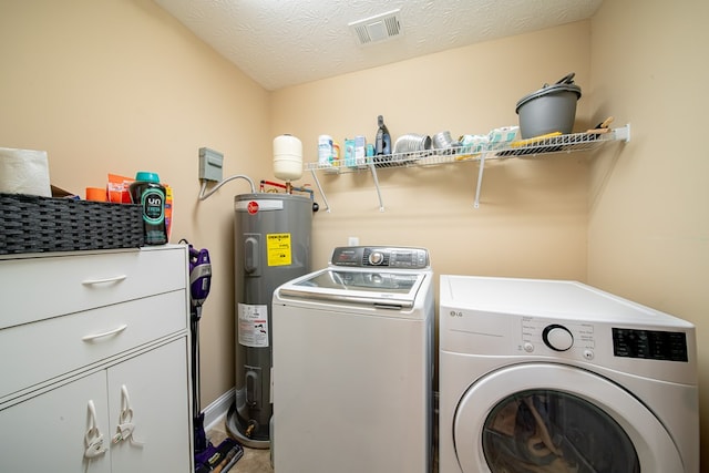 37 Oakwood Dr, Phenix City, AL 36870 - laundry area with electric water heater, separate washer and dryer, and cabinet space