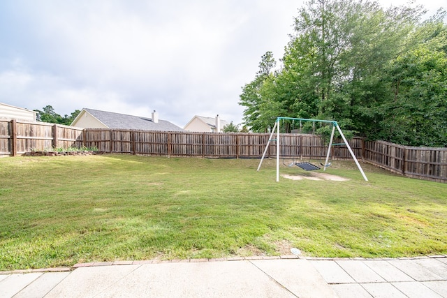 37 Oakwood Dr, Phenix City, AL 36870 - fenced backyard featuring a playground