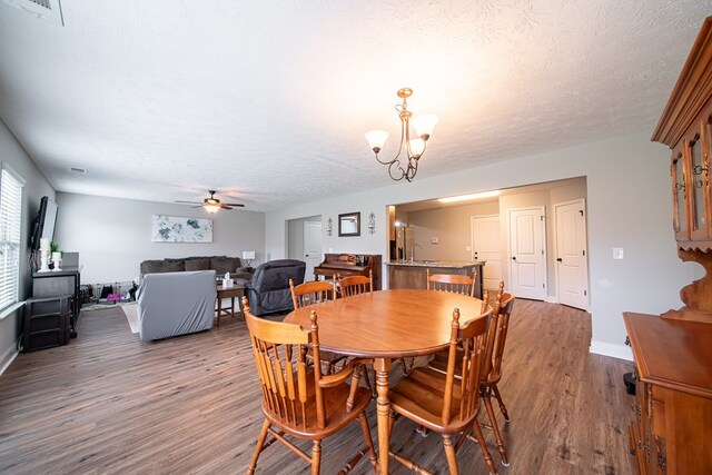 37 Oakwood Dr, Phenix City, AL 36870 - dining area featuring wood finished floors, ceiling fan, a textured ceiling, and a chandelier