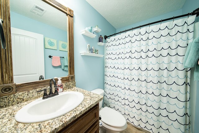 37 Oakwood Dr, Phenix City, AL 36870 - full bathroom with vanity, a shower with shower curtain, and a textured ceiling