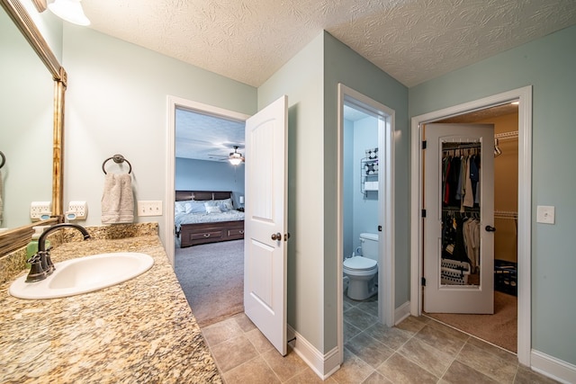 37 Oakwood Dr, Phenix City, AL 36870 - full bath featuring vanity, ensuite bathroom, tile patterned floors, and a walk in closet