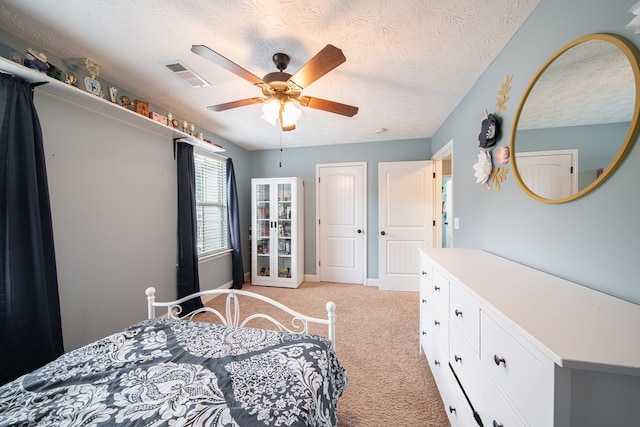 37 Oakwood Dr, Phenix City, AL 36870 - bedroom with light carpet, a textured ceiling, and a ceiling fan