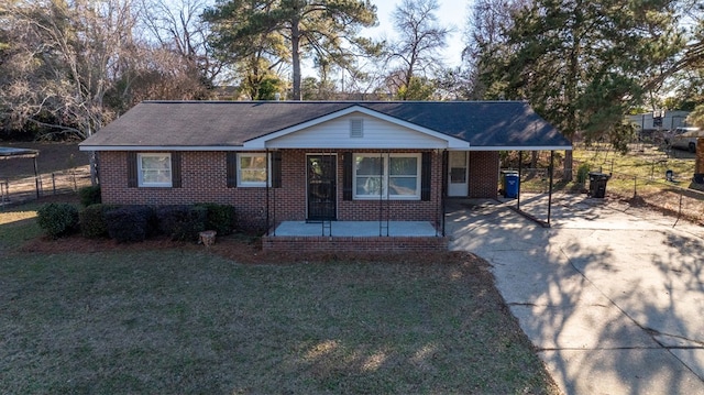 ranch-style house with a carport and a front yard