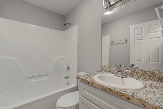 full bathroom with toilet, vanity, bathing tub / shower combination, and a textured ceiling