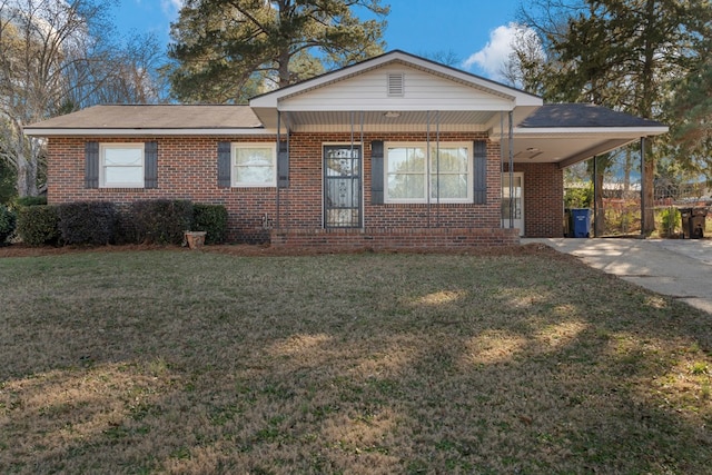 single story home featuring a carport and a front yard