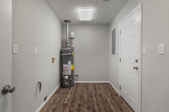 utility room with electric panel and water heater