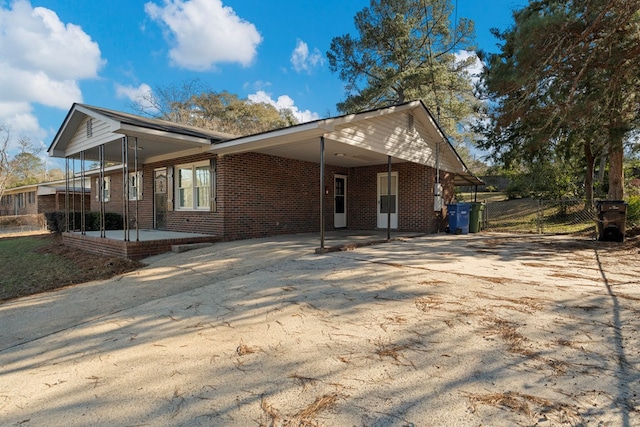 exterior space with a carport