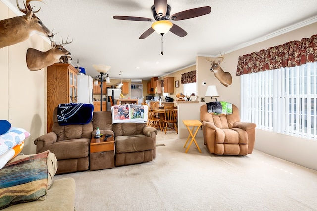 living room with light carpet, ceiling fan, and ornamental molding