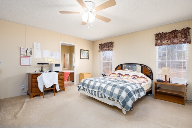 bedroom featuring a textured ceiling, ceiling fan, and carpet flooring