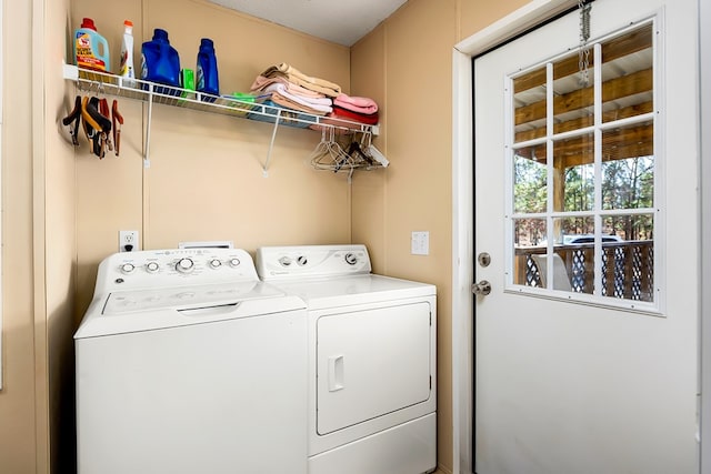 clothes washing area featuring washing machine and clothes dryer