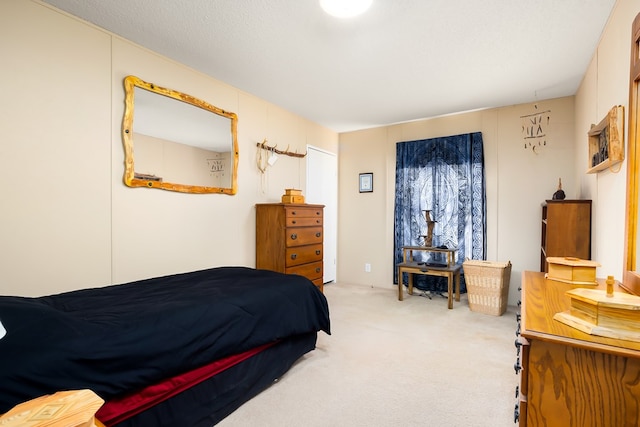 carpeted bedroom with a textured ceiling