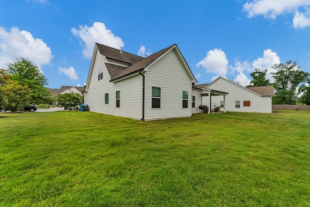 7546 Mockernut Way, Midland, GA 31820 - back of house with a lawn and a shingled roof