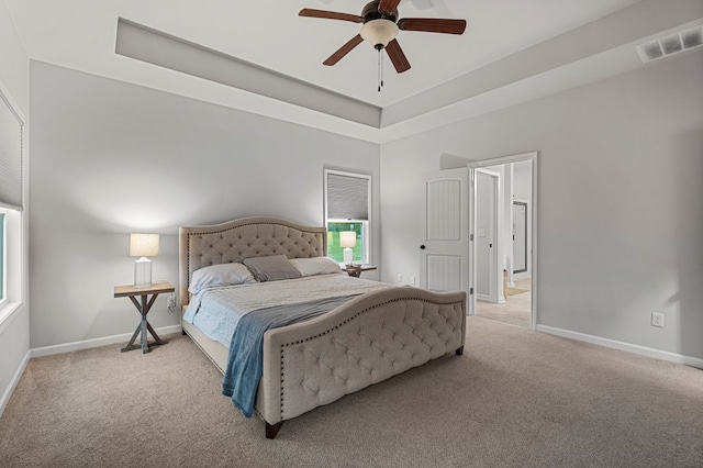 7546 Mockernut Way, Midland, GA 31820 - bedroom with light carpet, baseboards, a raised ceiling, and a ceiling fan