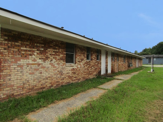 3406 Terminal St, Columbus, GA 31906 - view of home's exterior featuring brick siding and a lawn