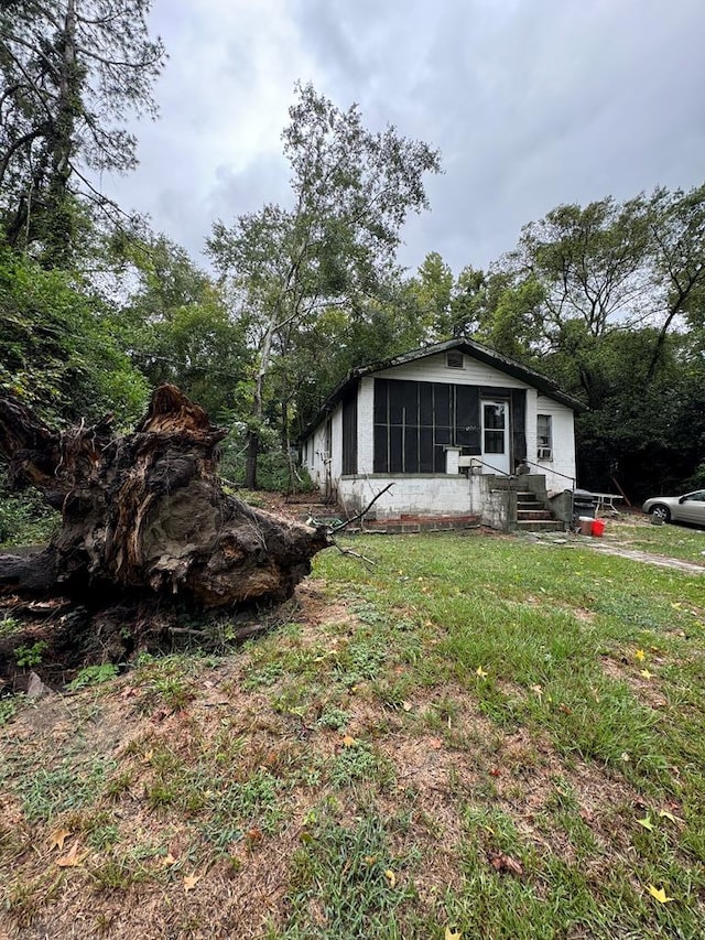 exterior space with a front yard