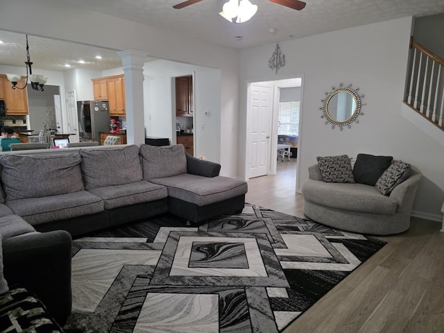 10315 Whisper Glen Ct, Midland, GA 31820 - living area featuring light wood-type flooring, a ceiling fan, stairway, baseboards, and recessed lighting