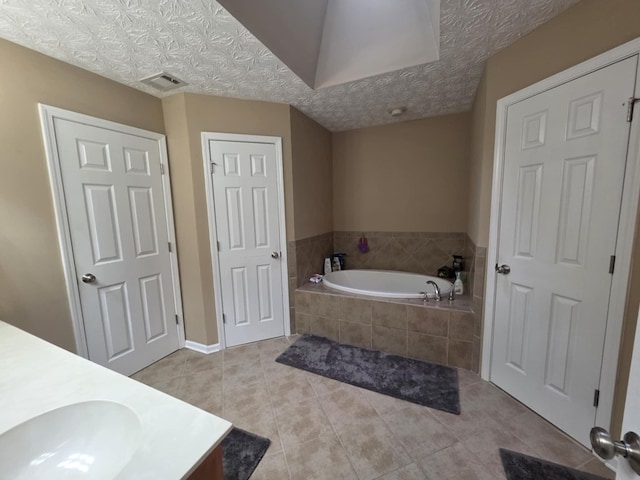 10315 Whisper Glen Ct, Midland, GA 31820 - bathroom featuring vanity, a bath, and tile patterned flooring