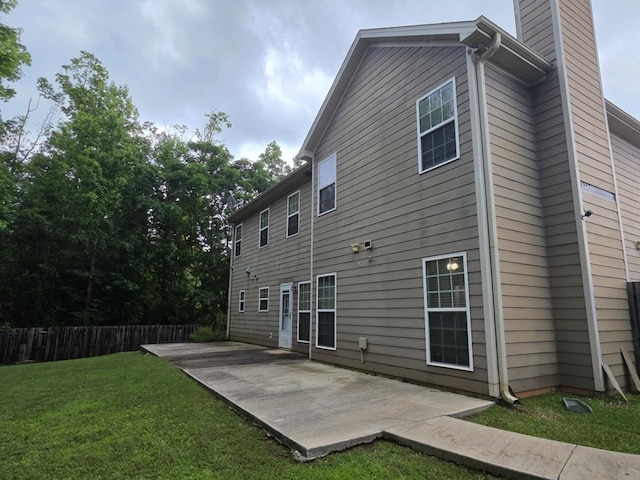 10315 Whisper Glen Ct, Midland, GA 31820 - rear view of house featuring a patio and a chimney