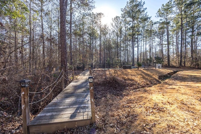 view of property's community with fence