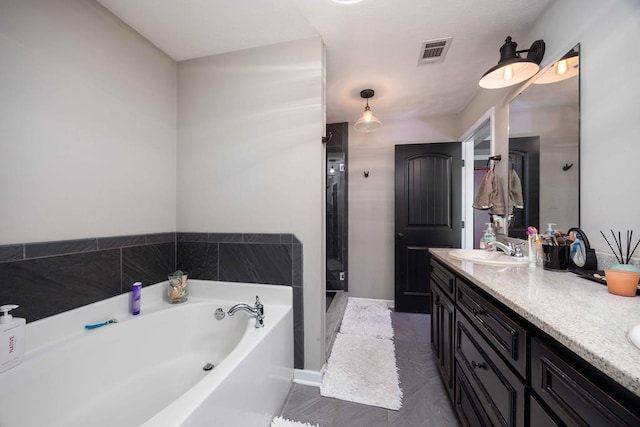 full bath featuring a sink, double vanity, visible vents, a garden tub, and a stall shower