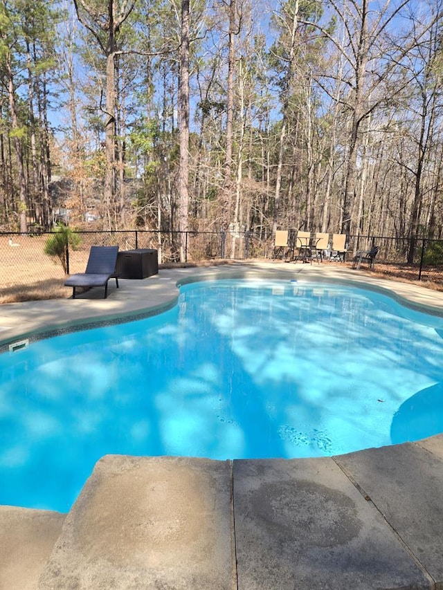 view of pool featuring a fenced in pool, a patio area, and fence
