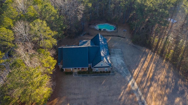 drone / aerial view with a view of trees