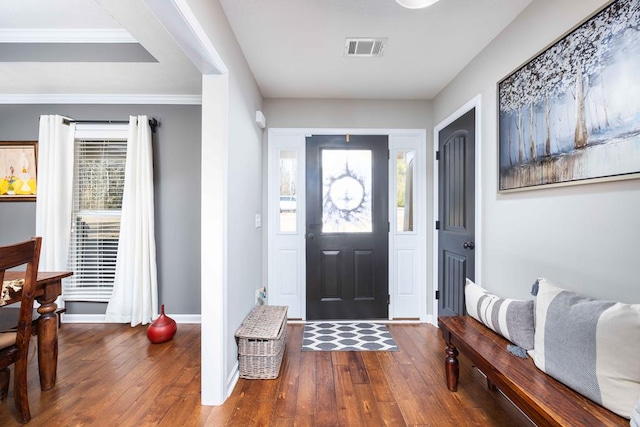 entryway featuring visible vents, baseboards, and hardwood / wood-style flooring