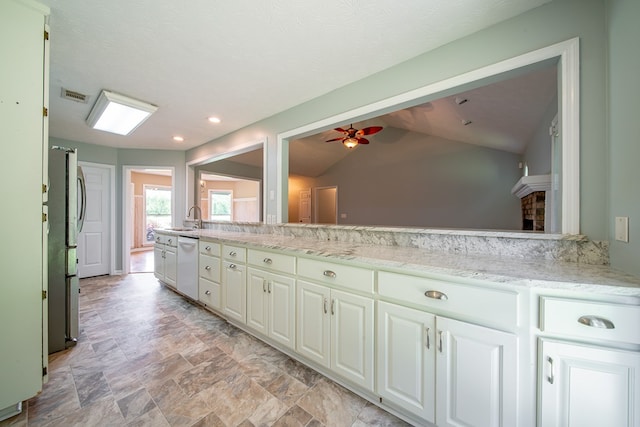 177 Wright Rd, Pine Mountain, GA 31822 - kitchen with dishwasher, a ceiling fan, white cabinetry, vaulted ceiling, and light stone counters