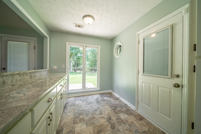 177 Wright Rd, Pine Mountain, GA 31822 - entryway with stone finish floors and a textured ceiling