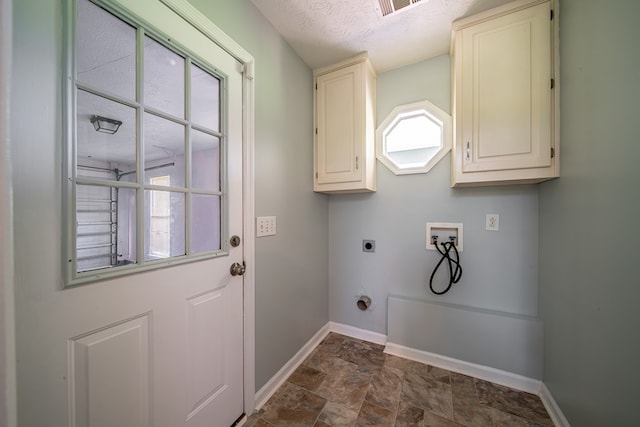177 Wright Rd, Pine Mountain, GA 31822 - washroom featuring electric dryer hookup, hookup for a washing machine, cabinet space, a textured ceiling, and dark stone finish floors
