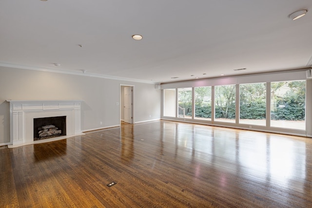 unfurnished living room featuring hardwood / wood-style floors and ornamental molding