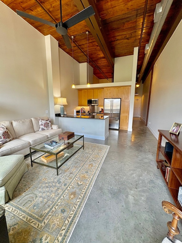 1201 Front Ave, Columbus, GA 31901 - living area with wooden ceiling and concrete flooring