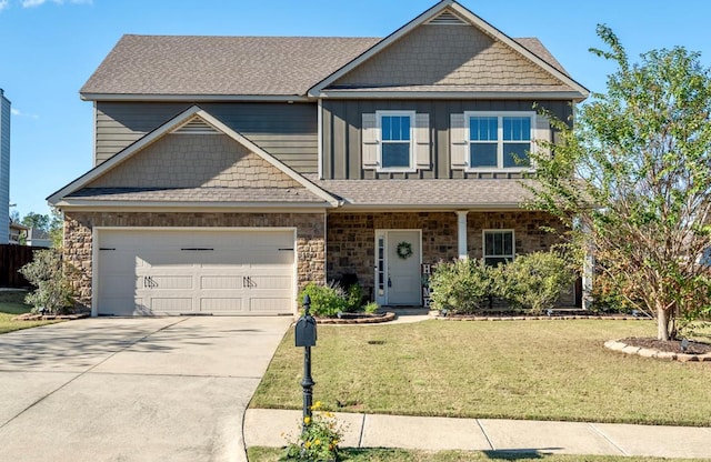 craftsman house with a garage and a front lawn