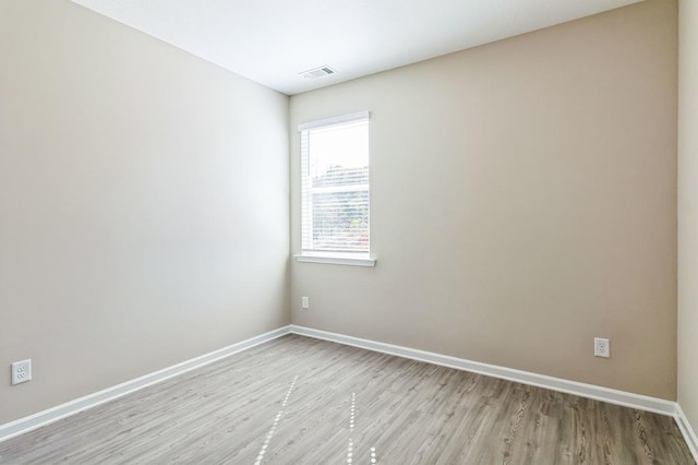 unfurnished room with light hardwood / wood-style floors