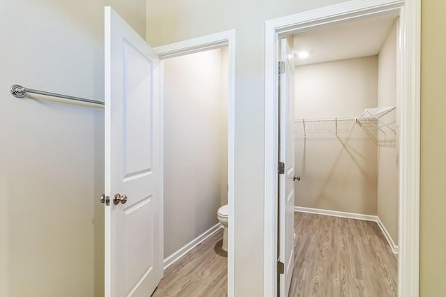 bathroom featuring toilet and hardwood / wood-style floors