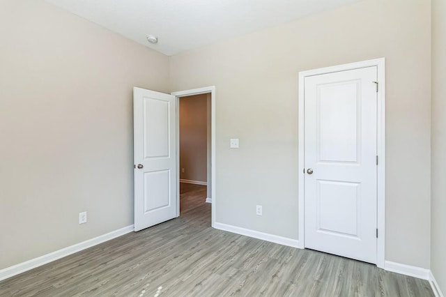 unfurnished bedroom with light hardwood / wood-style flooring