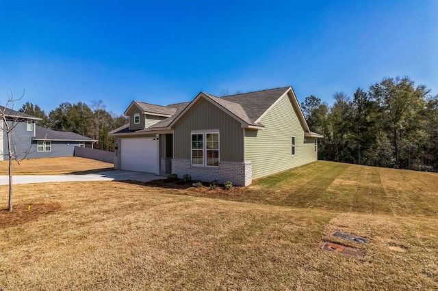 view of front of property with a garage and a front yard