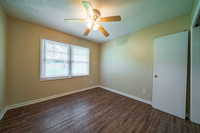 6127 Stony Creek Dr, Columbus, GA 31909 - spare room featuring dark wood finished floors, a ceiling fan, a textured ceiling, and baseboards