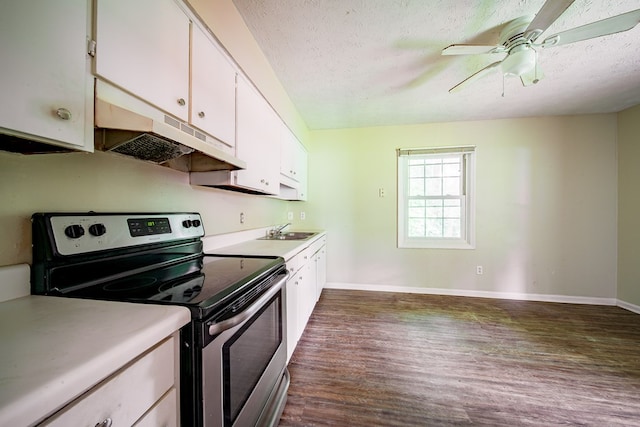 6127 Stony Creek Dr, Columbus, GA 31909 - kitchen with stainless steel range with electric stovetop, under cabinet range hood, dark wood-style flooring, a textured ceiling, and white cabinets
