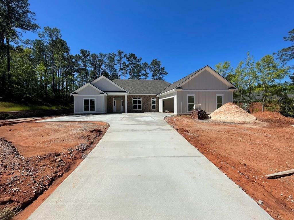 8033 Splendor Way, Columbus, GA 31904 - view of front facade featuring concrete driveway, a garage, and board and batten siding