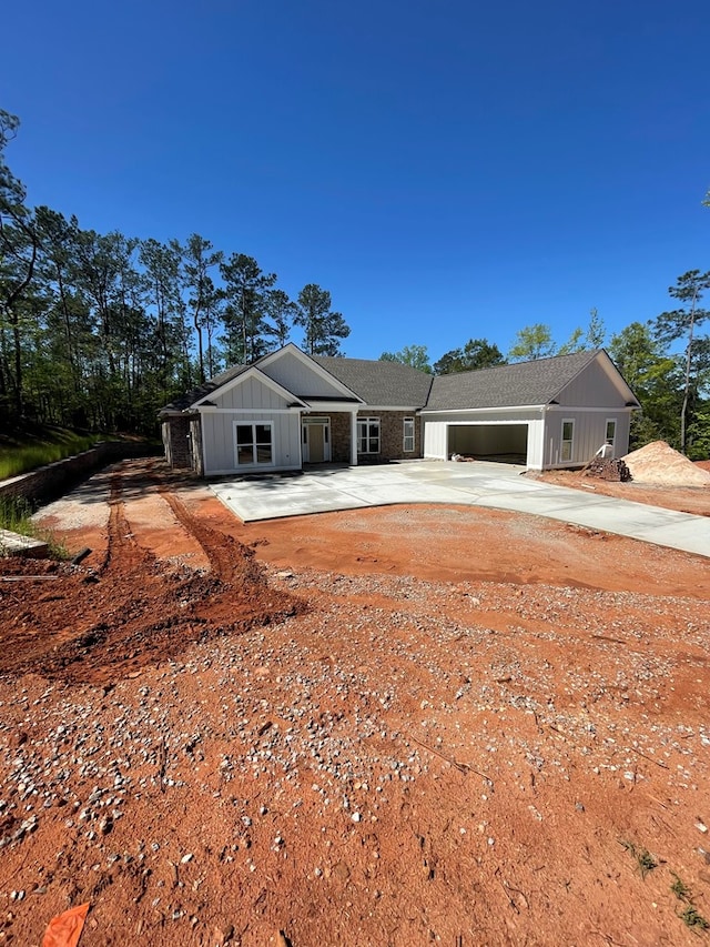 8033 Splendor Way, Columbus, GA 31904 - view of front facade featuring concrete driveway, board and batten siding, and an attached garage