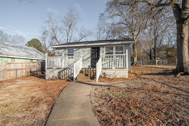 bungalow-style house with a wooden deck