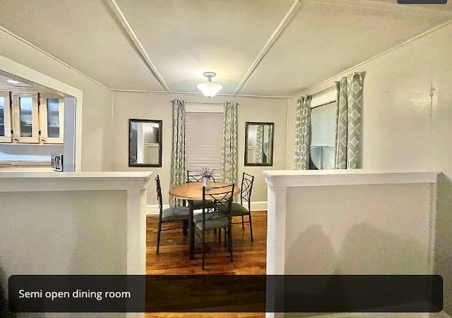 dining room with baseboards and wood finished floors